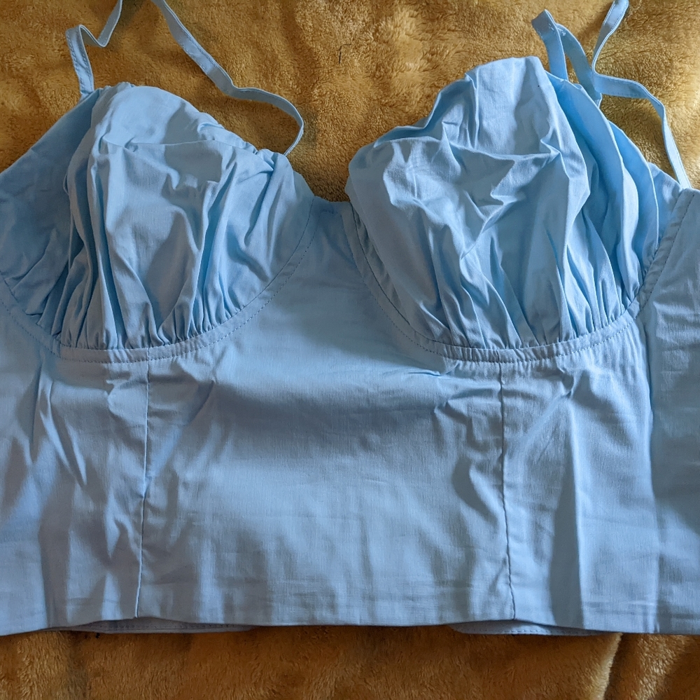 Blue ruffled lace up top